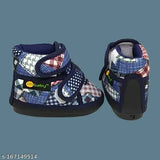 Bright blue, white, and black plaid velcro baby shoes with a patterned sole