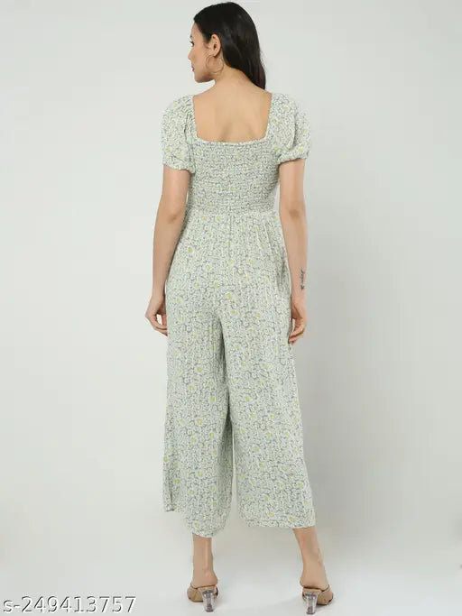 Green polyester smocking print jumpsuit for women, casual and comfortable with short sleeves, ideal for travel and any climate. Made in India