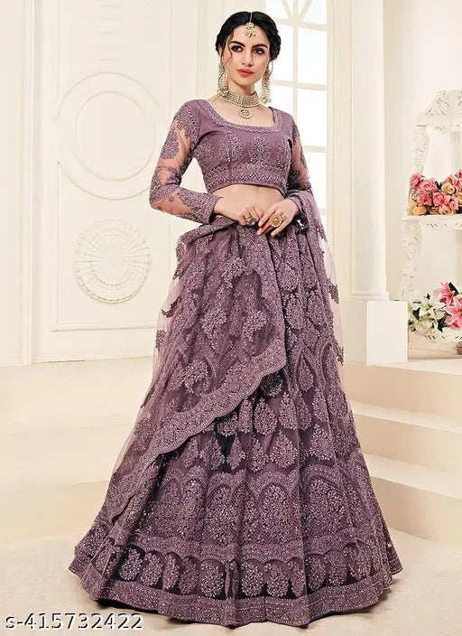 Fancy embroidered net lehenga-choli and dupatta set, free size with 42m waist, 42m length, and 2.05m dupatta length. Indian handcrafted bridal wear on display