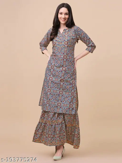 A woman wearing a long, patterned kurta with flared bottoms