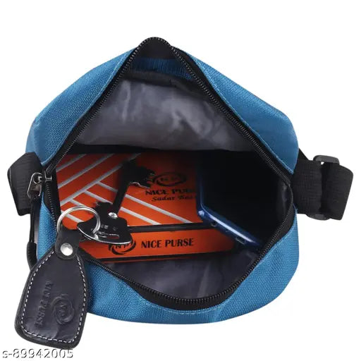 A blue men's or women's crossbody sling bag with a regular size and a closure that is not clearly visible