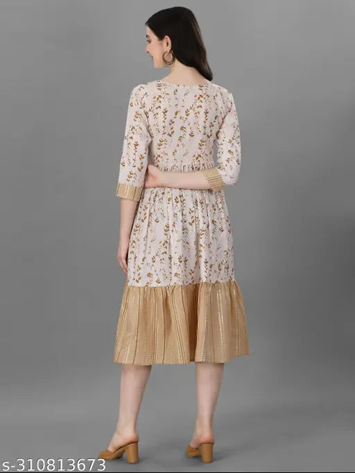 Floral printed, fit-flared cotton kurti with three-quarter sleeves, embellished embroidery. Ideal for parties, casual wear, or office attire