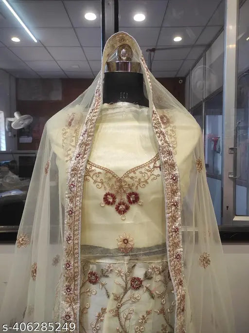 Attractive cream lehenga choli set with dupatta, embroidered net fabric for normal occasions and events. India origin