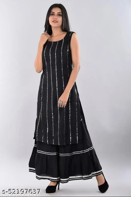 Black and white patterned women's kurta set with long skirt and short sleeves