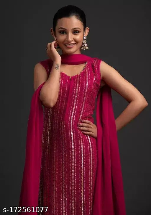 Red sequined sari with long pallu