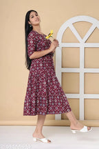 Cotton three-quarter sleeve floral print Anarkali kurta for women, vibrant Indian fashion on mannequin