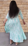 Festival gown, green and gold embroidered design