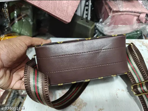 Beige and red sling bag, adjustable strap, multiple pockets