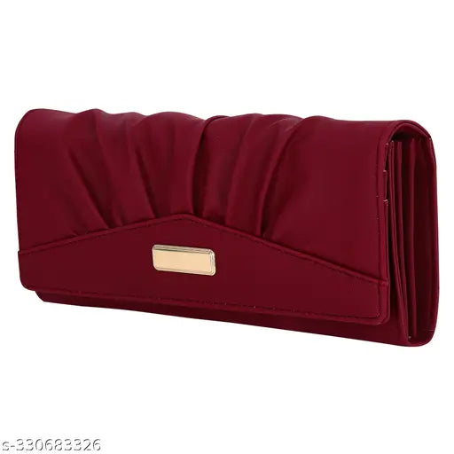 A burgundy hands clutch purse with multiple card slots and a phone pocket