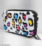 The image displays a small, compact suitcase with multiple compartments and a zipped main compartment. It features a vibrant pattern that includes shades of pink, blue, and yellow. The bag appears sturdy and suitable for travel, while its design also makes it fashionable and suitable as a handbag or shoulder bag