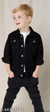 Black and white denim jacket, young boy standing in front of tan fabric, casual style