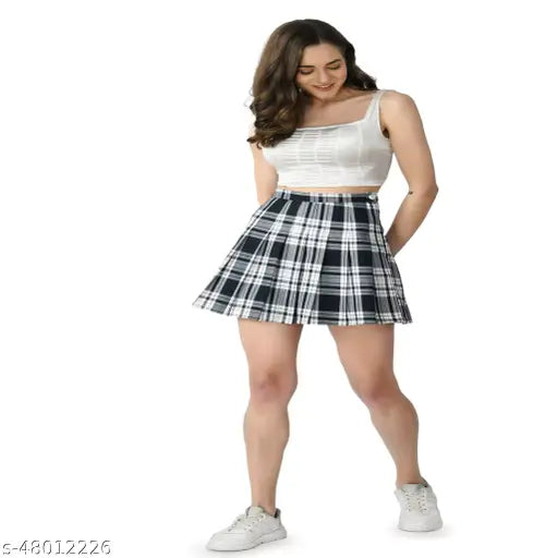 Checkered pleated tennis skirt with built-in shorts for women and girls. High-waisted polyester design available in multiple sizes. Perfect for fashionable occasions, parties, cycling, or casual wear. Made in India