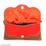 A women's red clutch with embroidered accents and a gold zip closure