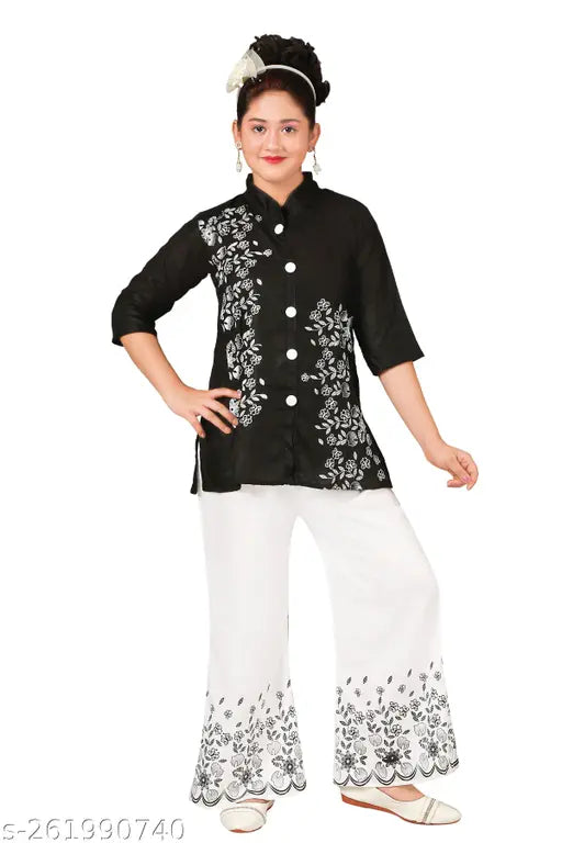 Black cotton blend kurti and plazo sets for girls, festive printed party wear with three-quarter sleeves, Indian kid's fashion on display