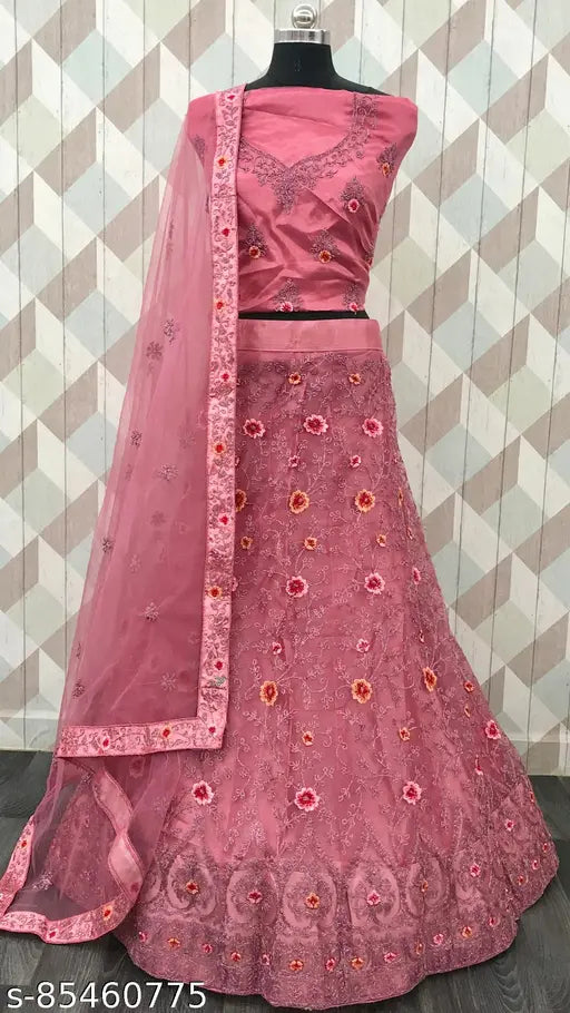 Pink semi-stitched net lehenga choli with detailed embroidery - perfect for festive celebrations, parties, and special events from Gopinath Hand Work. Indian ethnic wear with a modern twist