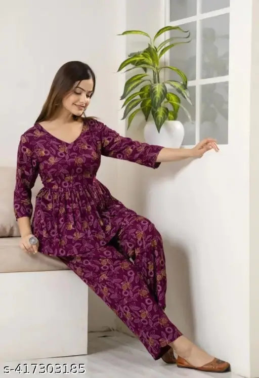 Wine premium rayon women's printed co-ord set with trendy pocket, featuring three-quarter sleeves and pyjama bottoms. Rayon fabric, Indian origin