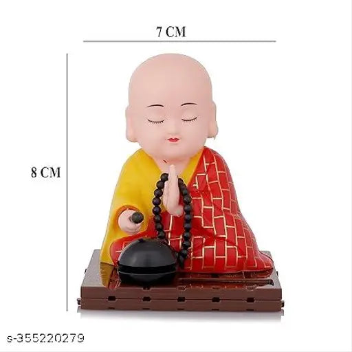 Multicolor solar-powered moving Little Buddha Monk figurine, eco-friendly automobile showpiece from India