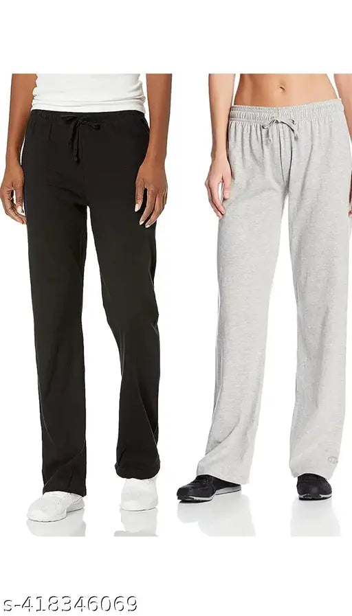 Black and grey men's jogging pants with white sneakers and black top in casual outfit combination