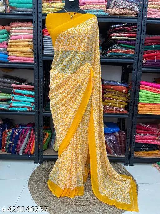 Yellow and black georgette sari with a border
