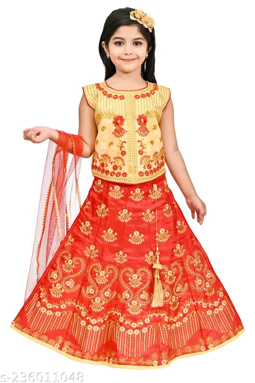 Yellow embroidered lehnga choli with red dupatta, embellished with tassels.