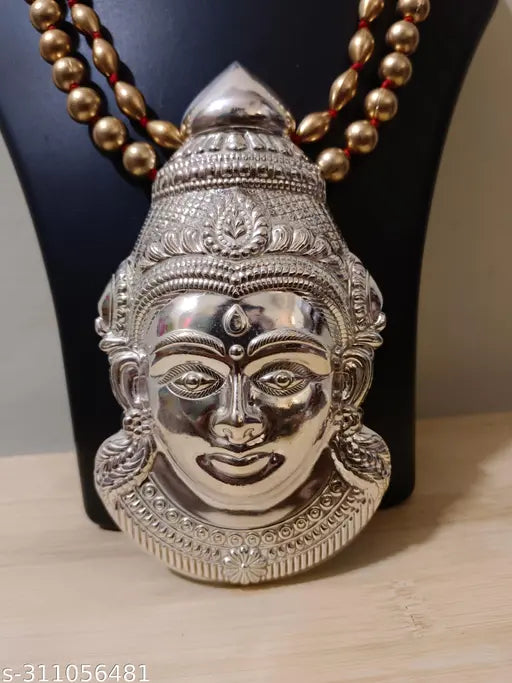 Metal Laxmi idol, ornate Laxmi mukuta, intricate Laxmi Pooja face for traditional Hindu worship