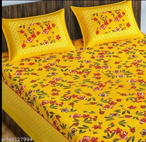 Yellow cotton Rajasthani bedsheet set with red floral print, 2 pillow covers.