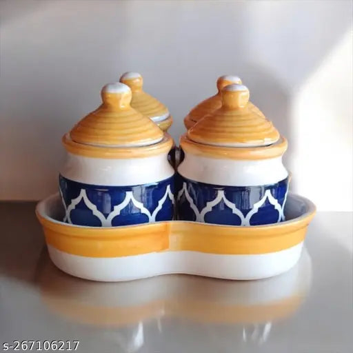 Multicolored ceramic jars with matching lids and holding tray, set of four storage containers for pickles or chutneys, blue yellow and white design, suitable for dining table use