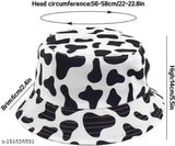 A black, white, and cream bucket hat with a reversible pattern
