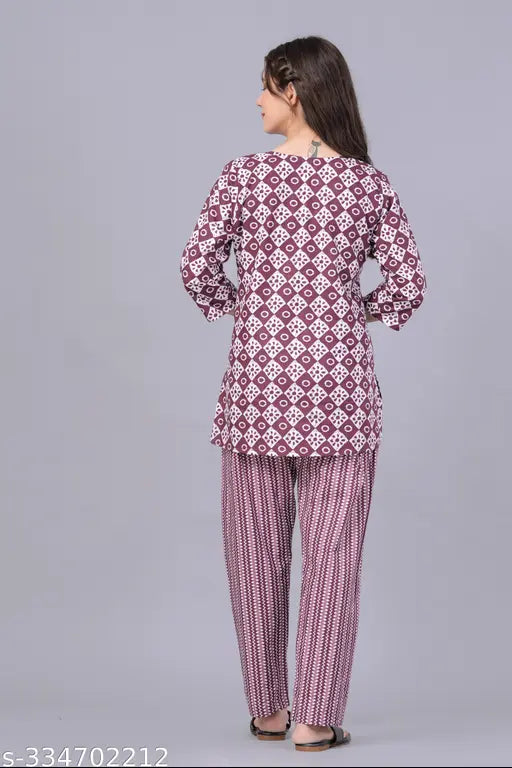 Pure cotton coord night suit for women, printed in vibrant Indian-inspired patterns. Top with three-quarter sleeves and pyjamas featuring wide waistband for comfort. Perfect for hot weather and versatile for various occasions. 100% breathable, color bleeding resistant, and machine washable. Made in India