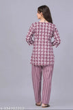 Pure cotton coord night suit for women, printed in vibrant Indian-inspired patterns. Top with three-quarter sleeves and pyjamas featuring wide waistband for comfort. Perfect for hot weather and versatile for various occasions. 100% breathable, color bleeding resistant, and machine washable. Made in India