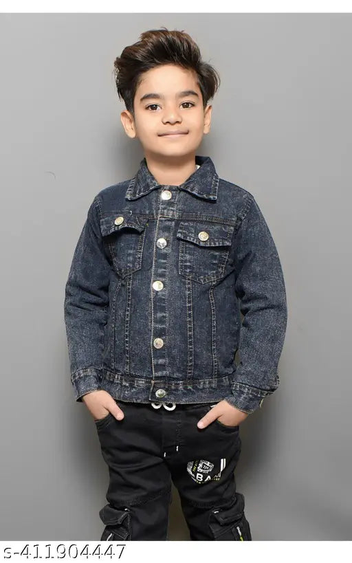 A young boy wearing a denim jacket with a button closure, posing for a portrait