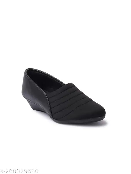 Synthetic black sneakers by Furiozz - Solid design with closed back, offering comfort and style for women