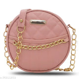 Pink small sling bag with gold chains, chain straps, and a round front detail
