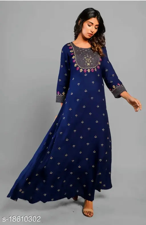A woman wearing an embroidered blue rayon kurta