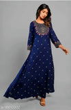 A woman wearing an embroidered blue rayon kurta