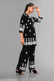 Black Bhavani Fashion Women's Rayon Printed Top and Palazzo Set, embellished with Jaipuri handwork, Gota Patti work, and sequins. Ideal for parties, weddings, or festive occasions. Unstitched salwar suit dress material includes dupatta. Durable and smooth texture, loved in India