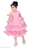 Pink tulle party dress with ruffled sleeves, black satin sash, and sequins on the bodice