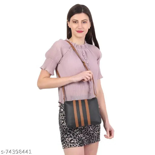 Black faux leather women's sling bag with adjustable shoulder strap