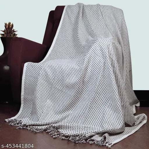 Brown and white cotton hand-woven sofa throw with fringes, striped pattern, ideal for living room, bedroom, or office decor. Size: 140 x 180 cm
