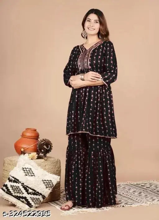 Black and gold embroidered women's sharara and kurta set
