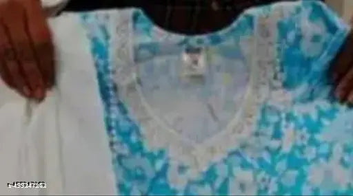 A fashionable light blue patterned kameez and matching dupatta on a mannequin