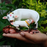 Poly resin Kamdhenu cow figurine with calf, decorated with precious stones for spiritual and materialistic success