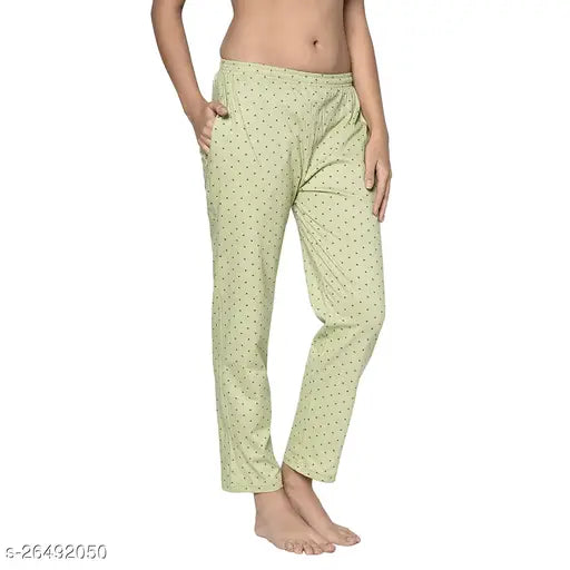 Light green women's pyjama pants with white polka dot pattern