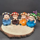 Multicolor polyresin baby monk Buddha idols (4 pieces) - Indian handcrafted home decor piece for positive energy enhancement