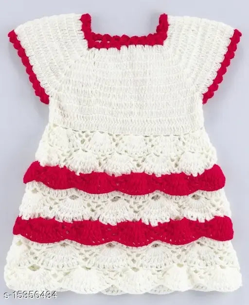 A white crocheted top with red decorative edging