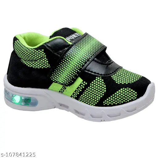 Kids LED light shoes PGREEN, EVA sole running shoes for boys and girls. Vibrant design, ideal for parties, sports, and casual wear. Upper made of high-quality resin leather. Comfortable, hugging lining by SMARTOTS. Sizes: 12-18 Months (13 Cms), 18-24 Months (13.5 Cms), 2-2.5 Yrs (14 Cms), 2.5-3 Yrs (14.5 Cms), 3-3.5 Yrs (15 Cms). Made in India