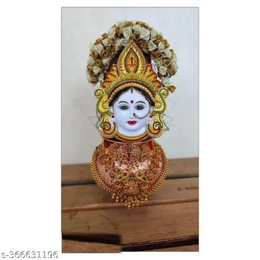 Yellow plastic Mahalakshmi face figurine for home or office, brings prosperity and beauty. Model YELLOW 01, 4 inch in length, 15 inch in height, and 15 inch in breadth. Ideal for worship during Marghshish month or any time. Indian origin