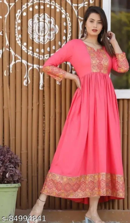 Pink embroidered kameez with long sleeves, fitted waist, and straight cut