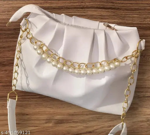 Gold pearl necklace, casual purse with ruffle trim