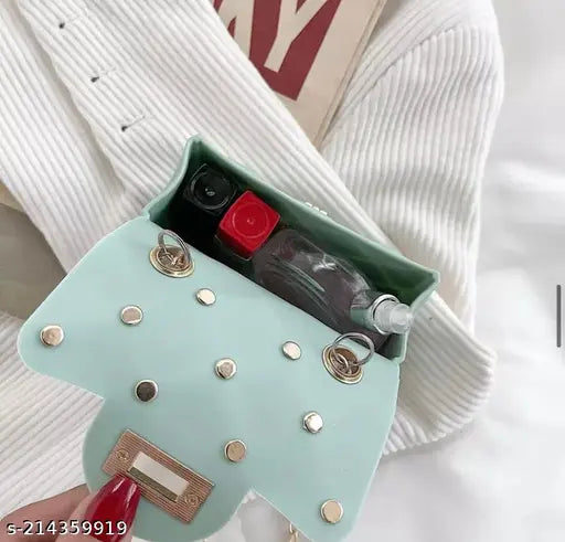 Jewel-hub presentable small sling bag, silicone side shoulder crossbody style, in a dark green color, featuring multiple compartments with zip closures and adjustable straps. Ideal for casual travel or party use